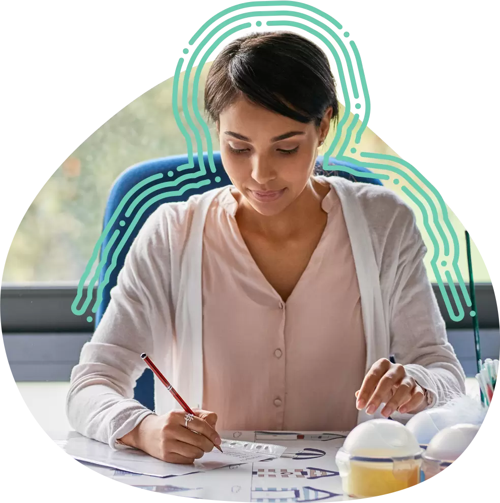 Teacher writing in a notebook